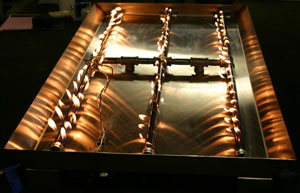 Custom propane pan for fireplace glass